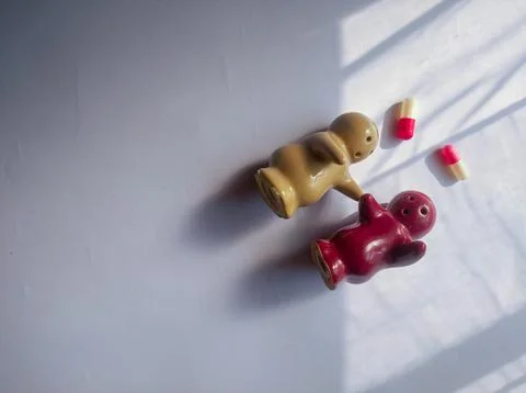 Flat lay photo of a pair of ceramic dolls Stock Photos