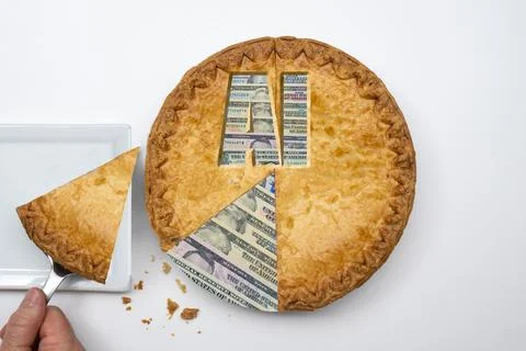 Flat lay photo of a slice of pie made of money being served onto a white square 写真素材