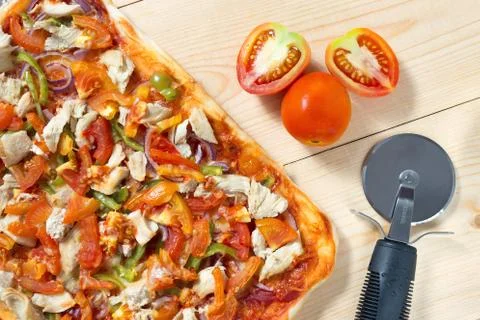 Flat lay pizza composition, tomatoes on wooden surface, close up macro Stock Photos