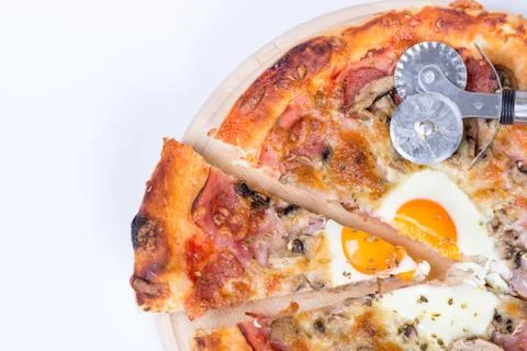 Flat lay of pizza slice with egg ham mushrooms Stock Photos