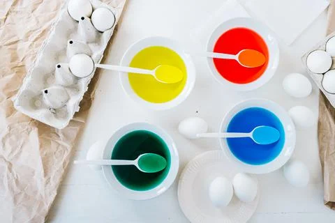 Flat lay Preparing for Easter, dyeing eggs with liquid food coloring. Different Stock Photos