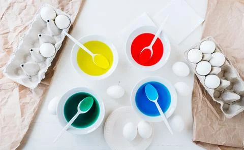 Flat lay Preparing for Easter with liquid food coloring. Different colors in  Stock Photos