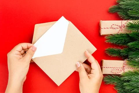 Flat lay, process of sending letter to Santa Claus in craft envelope on isolated Stock Photos