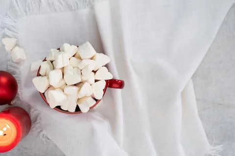 Flat lay red winter tea cup on white napkin Stock Photos