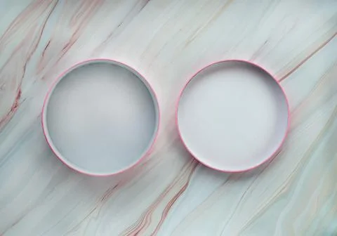 Flat lay of round box with open lid on beautiful marble background Stock Photos