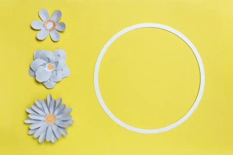 Flat lay of round card frame, color paper flowers design Stock Photos