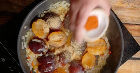 Flat lay sauce making: adding the hot spices to the pan with sauce ingredients Stock Footage 217751002