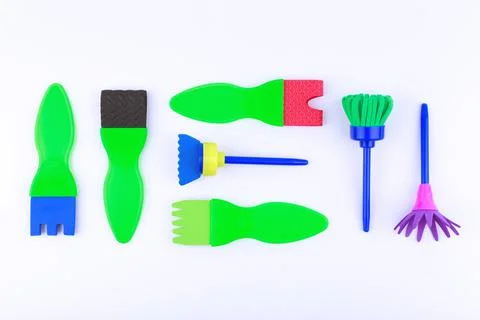 Flat lay with set of different brushes for painting isolated on white background Stock Photos