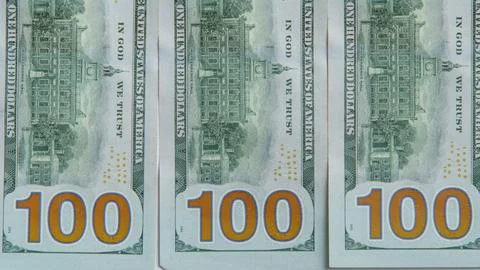 Flat lay of several one hundred 100 dollars banknotes bills greenbacks arrang Stock Photos