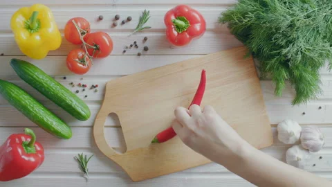 Flat lay of slicing a red hot chilie pepper, vegetables Stock Footage 86042647