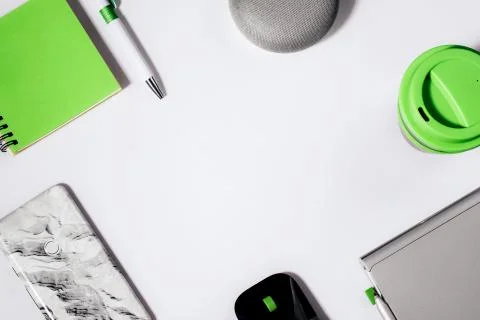 Flat lay of smart speaker with LED lights activated with cropped smartphone Stock Photos