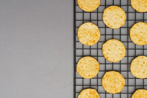 Flat lay of snack, Crispy potato chip arrange on rack oven baked over gray ba Stock Photos