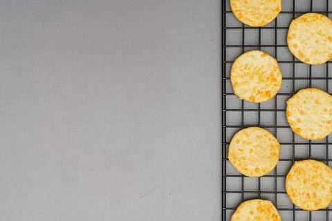 Flat lay of snack, Crispy potato chip arrange on rack oven baked over gray ba Stock Photos
