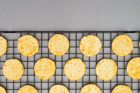 Flat lay of snack, Crispy potato chip arrange on rack oven baked over gray ba Stock Photos