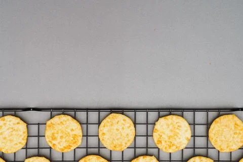 Flat lay of snack, Crispy potato chip arrange on rack oven baked over gray ba Stock Photos