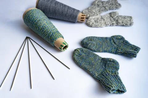 Flat lay of socks, thread and needles Stock Photos