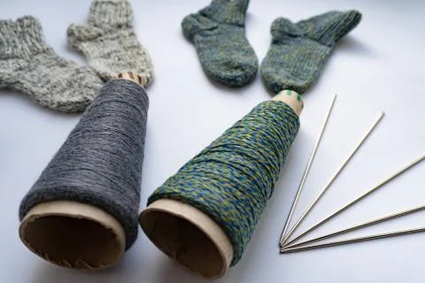 Flat lay of socks, thread and needles Stock Photos