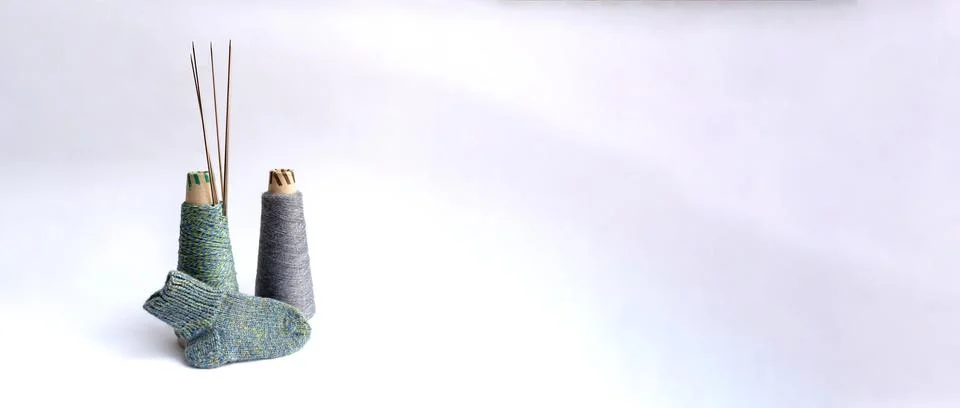 Flat lay of socks, thread and needles Stock Photos