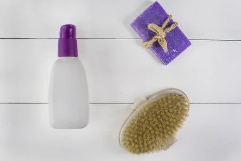 Flat lay spa bath on white wooden background, top view products for hygiene. Stock Photos