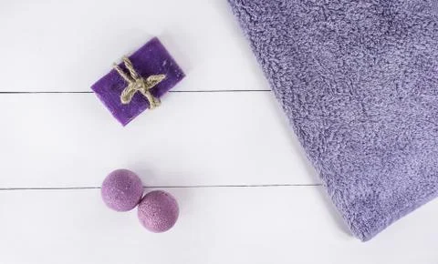 Flat lay spa bath on white wooden background, top view products for hygiene. Stock Photos