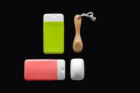 Flat lay spa composition with skin care products on black background. Stock Photos