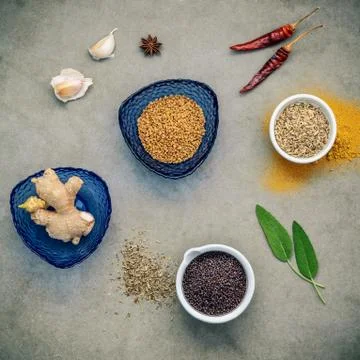 Flat lay of spices ingredients on dark background. Stock Photos