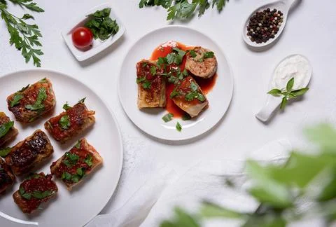 Flat lay with stuffed cabbage rolls and ingredients on white background Stock Photos