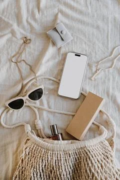 Flat Lay of Summer Essentials in Beige. Stylish Arrangement of Smartphone, Su Stock Photos