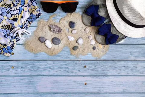 Flat lay summer holiday background, beach accessories on a blue wooden table Stock Photos