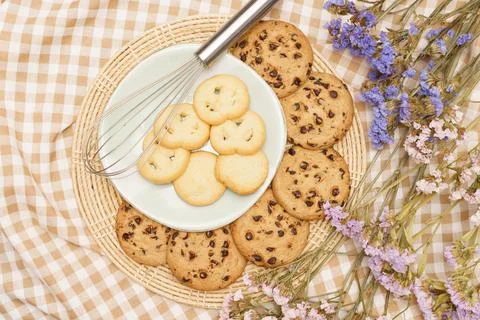 Flat lay of sweets, Butter cookie and chocolate chip cookie in container on b Stock Photos