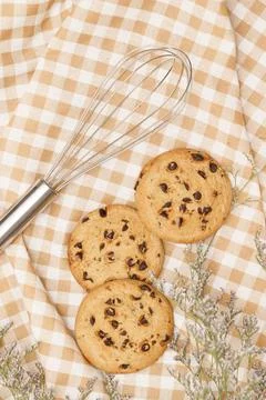 Flat lay of sweets, Chocolate chip cookies and confectionery equipment on bro Stock Photos