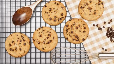 Flat lay of sweets, Chocolate chip cookie and confection equipment on rack an Stock Photos