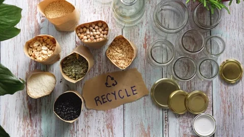 Flat lay of table with bulk food in paper bags and recycled jars with woman.. Stock Footage 285269878