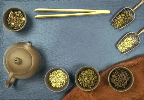 Flat lay tea set on a dark blue table Stock Photos