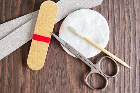 Flat lay template with manicure tools, scissors, nail file, cotton pad Stock Photos