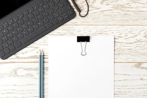 Flat lay template with paper, tablet and pencils on the work desk Stock Photos