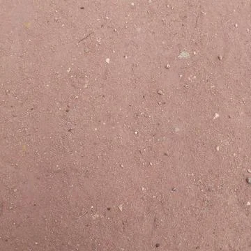 Flat lay texture of rough reddish brown dirt sand and fine gravel surface Stock Photos