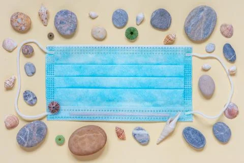 Flat lay on the theme of beach vacation during the coronavirus period. Stock Photos