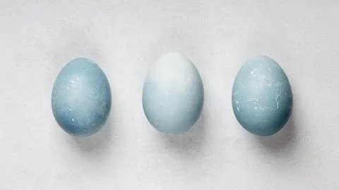 Flat lay three easter eggs Stock Photos