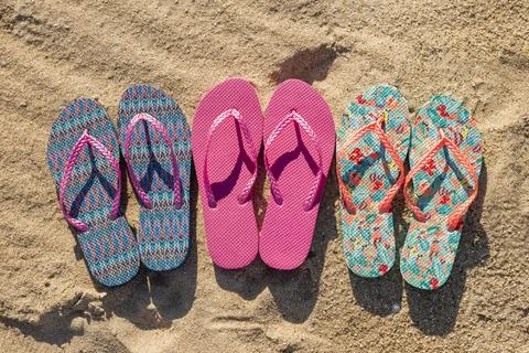 Flat lay three pairs flip flops. High quality photo Stock Photos