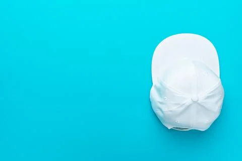 Flat lay top-down composition of white snapback cap Stock Photos