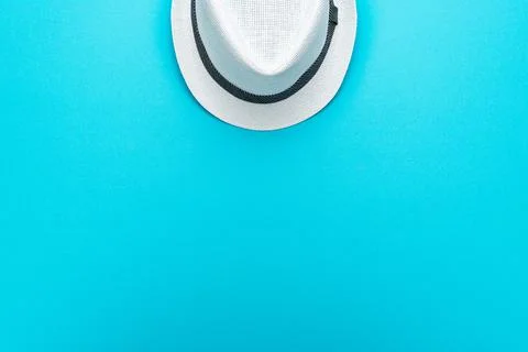 Flat lay top-down composition of white trilby hat Stock Photos