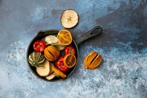 Flat lay top down image of dried seasonal Winter fruit on textured rough back Stock Photos