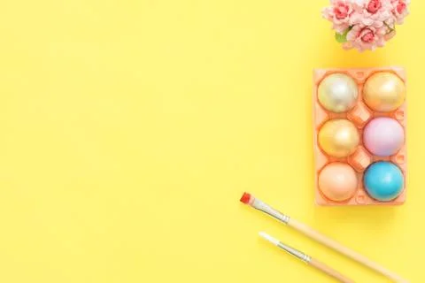 Flat lay top view colorful easter egg painted in pastel colors composition. Stock Photos