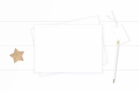 Flat lay top view elegant white Christmas composition paper pencil tag star s Stock Photos
