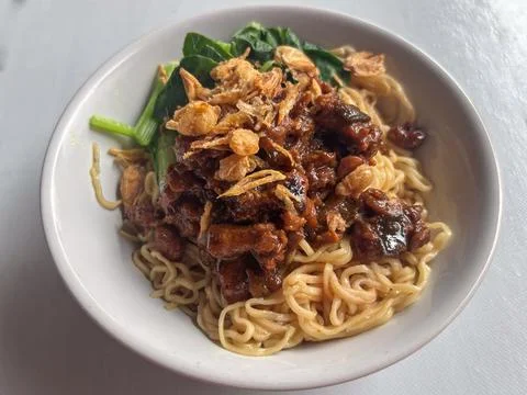 Flat Lay Top View of Indonesian Chicken Noodles in Bowl Stock Photos
