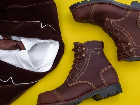 Flat lay, top view, men fashion casual clothing set isolated on yellow backgr Stock Photos