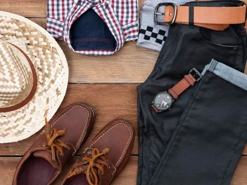 Flat lay, top view, men fashion casual clothing set on wooden background incl Stock Photos