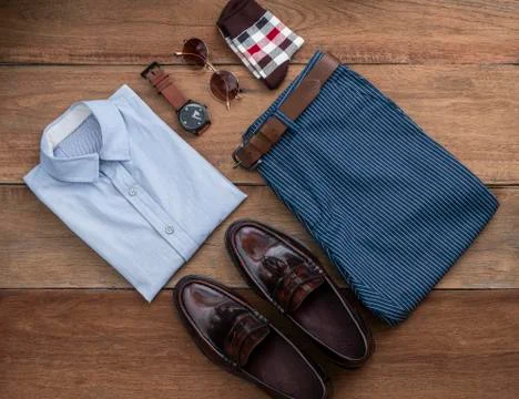 Flat lay, top view, men fashion casual clothing set on wooden background incl Stock Photos