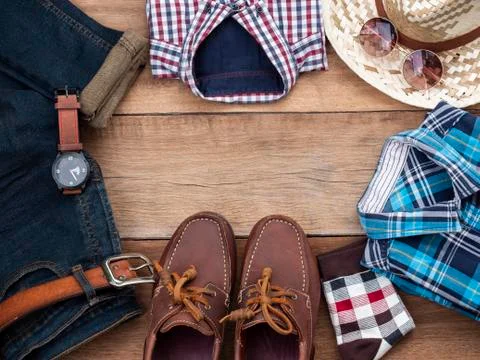 Flat lay, top view, men fashion casual clothing set on wooden background incl Stock Photos